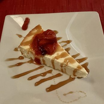 Glass House Tavern - NY-styled cheesecake with a caramel drizzle - American Near Me - New York, New York Glass House Tavern - NY-styled cheesecake with a caramel drizzle - American Near Me - New York, New York