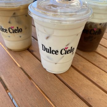 Dulce Cielo - Clockwise starting in front: iced chai tea latte, cafe latte with oat milk and brewteaful with coconut cream. - Bakeries Near Me - Monrovia, California Dulce Cielo - Clockwise starting in front: iced chai tea latte, cafe latte with oat milk and brewteaful with coconut cream. - Bakeries Near Me - Monrovia, California