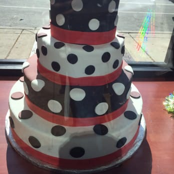 Ace Bakery - One of the cakes on their display with crooked ribbon and lumpy fondant - Custom Cakes Near Me - Chicago, Illinois
