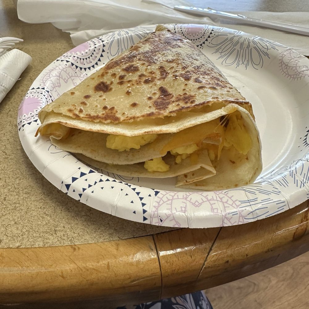 Scrambled egg sausage and cheese crepe. Scrambled egg sausage and cheese crepe.
