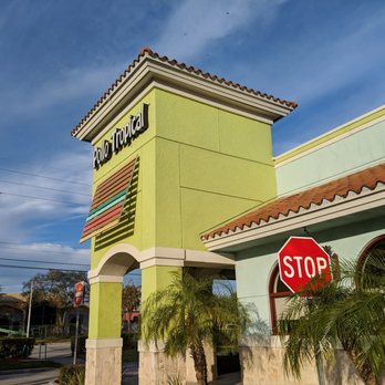 Pollo Tropical - a stop sign in front of a restaurant - Latin American Near Me - Orlando, Florida Pollo Tropical - a stop sign in front of a restaurant - Latin American Near Me - Orlando, Florida
