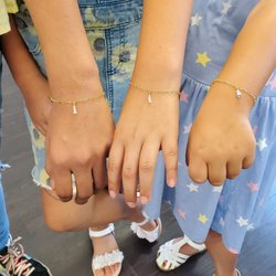 Permanent jewelry is safe for all ages! Young girls love our heart chain and crystal charms!