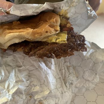 Gross' Burgers -  person holding a sandwich - Sandwiches Near Me - Danville, Illinois