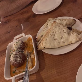 Luigi’s Italian Eatery - Arancini and cheesy bread - Italian Near Me - Seattle, Washington Luigi’s Italian Eatery - Arancini and cheesy bread - Italian Near Me - Seattle, Washington