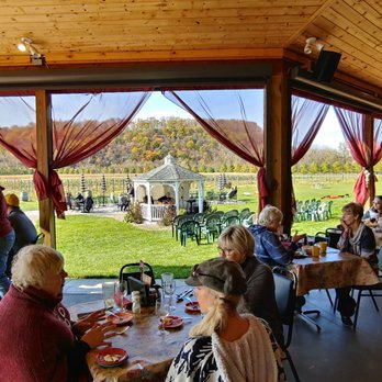 Vino In the Valley - Dining looking outside to another bar and seating area - American Near Me - Maiden Rock, Wisconsin Vino In the Valley - Dining looking outside to another bar and seating area - American Near Me - Maiden Rock, Wisconsin