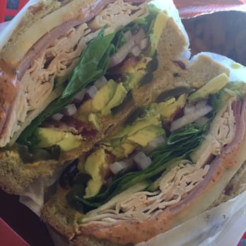 Yo-Way Eatery - Cranberry & nuts bread toasted, with turkey, ham, Cajun mayo, mustard, spinach, avocado, bacon & cheese. - Juice Bars & Smoothies Near Me - Gardena, California