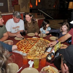 Monkey In the Middle Pizza - Family eating our Gorilla Pizza