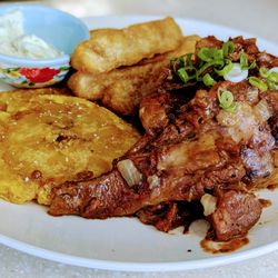 Collado’s Cuban Cuisine - Chivo guisado, tostones y yuca frita