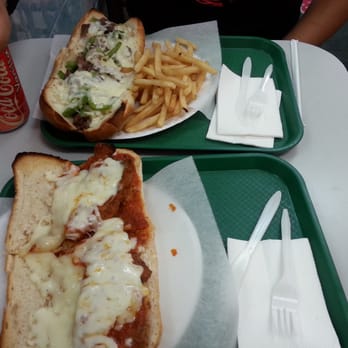 Delicias Pizza & Fried Chicken - Bottom sandwich is chicken parm and top one is philly cheese steak sandwich that comes with fries and soda - Mexican Near Me - Flushing, New York Delicias Pizza & Fried Chicken - Bottom sandwich is chicken parm and top one is philly cheese steak sandwich that comes with fries and soda - Mexican Near Me - Flushing, New York