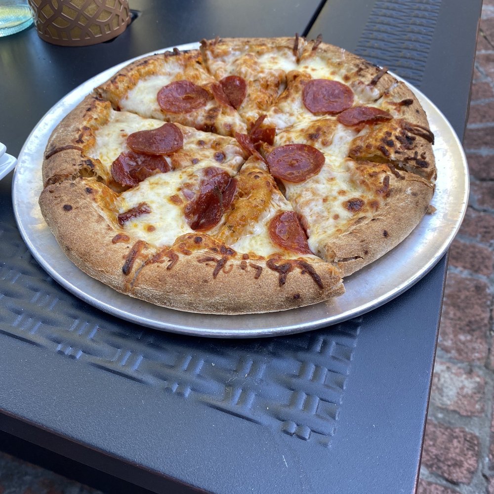 Pourr Decisions wine lounge - Stone oven pizza with pepperoni - Wine Bars Near Me - Modesto, California Pourr Decisions wine lounge - Stone oven pizza with pepperoni - Wine Bars Near Me - Modesto, California