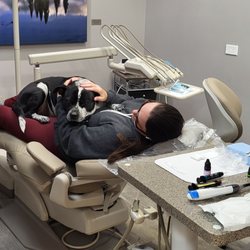 Beyond Dental Care - Mr. Woodford helping calm a patient during a dental visit.