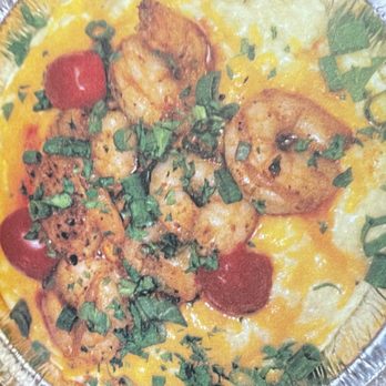 Vons Vittles - Cheesy Shrimp & Grits - A dish featuring shrimp, cherry tomatoes, and chopped herbs served over scrambled eggs, presented in a foil container. - Caterers Near Me - Munster, Indiana