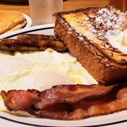 Split Decision Breakfast - 2 French toast, 2 bacon, 2 sausage, 2 pancakes, 2 eggs your way (over easy here). A great decision. Split Decision Breakfast - 2 French toast, 2 bacon, 2 sausage, 2 pancakes, 2 eggs your way (over easy here). A great decision.