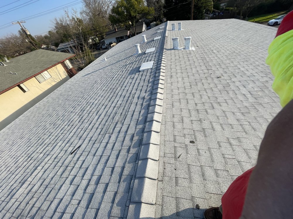 Slide of New Era Roofing