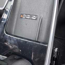 Dollar Car Rental - Armrest area CRUST NOT PROPERLY CLEANED WIPED DOWN