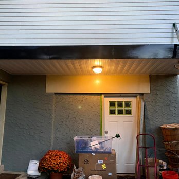 Tri-State Contracting - a house with a ladder and boxes outside - Handyman Near Me - Wallingford, Pennsylvania