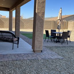 a patio with a table and chairs a patio with a table and chairs