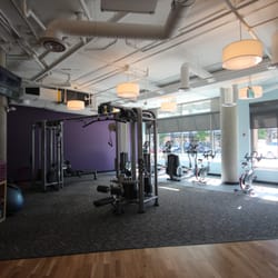 Anytime Fitness - Newly expanded space with dual cable crossover and additional cardio along the windows