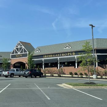 Ned Devine's - Outside / Exterior pic of Ned Devine's - in Village Center at Dulles ("Clocktower Shopping Center") with Giant, Mission BBQ, Chuck E Cheese - Sports Bars Near Me - Herndon, Virginia