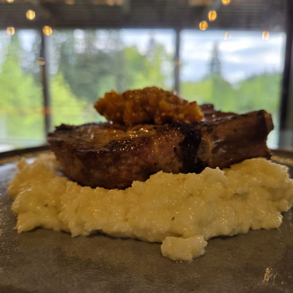 Sweet Waters on the River - Kurbota Pork bone in with grits - American Near Me - Eugene, Oregon Sweet Waters on the River - Kurbota Pork bone in with grits - American Near Me - Eugene, Oregon