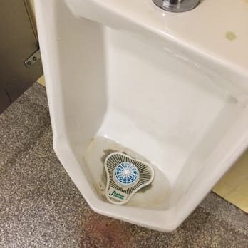 Getgo - Brown stuff at the bottom of the urinal.  Obviously not cleaned in months for this type of build up to occur.  Yuck. - Gas Stations Near Me - Delmont, Pennsylvania