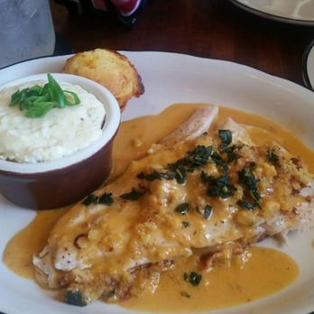 Moonshine Grill - Rainbow stuffed trout with green chile cheese grits. - Southern Near Me - Austin, Texas