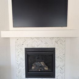 TV mounted over our fireplace. TV mounted over our fireplace.