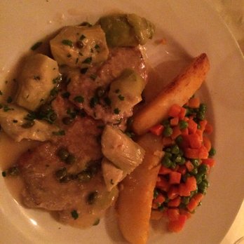 Cellini Italian Restaurant in Midtown Manhattan - Vitello Pantelleria Veal scaloppini, capers, roasted artichokes, lemon- wine sauce, olive oil, parsley - Italian Near Me - New York, New York Cellini Italian Restaurant in Midtown Manhattan - Vitello Pantelleria Veal scaloppini, capers, roasted artichokes, lemon- wine sauce, olive oil, parsley - Italian Near Me - New York, New York