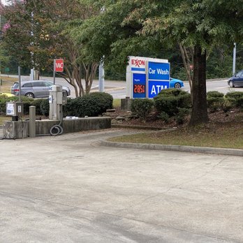 Bluff Park Exxon - a parking lot with a sign and a car - Convenience Stores Near Me - Birmingham, Alabama Bluff Park Exxon - a parking lot with a sign and a car - Convenience Stores Near Me - Birmingham, Alabama