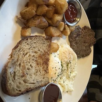 Littlebird - Two eggs with toast, potatoes and a side of sausage patty - New American Near Me - Grand Rapids, Michigan Littlebird - Two eggs with toast, potatoes and a side of sausage patty - New American Near Me - Grand Rapids, Michigan