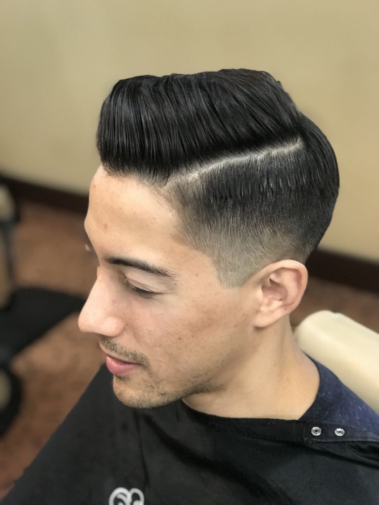 The Fade And Taper Logo