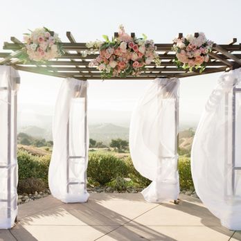 Bings Design - Kimberly's work on our gazebo: drapes & florals. - Floral Designers Near Me