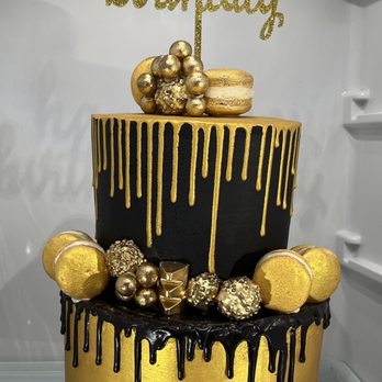 Dulce Luxe Bakery - Custom 2 tier black and gold cake. Flavor: White cake with Strawberry purée. - Desserts Near Me Dulce Luxe Bakery - Custom 2 tier black and gold cake. Flavor: White cake with Strawberry purée. - Desserts Near Me