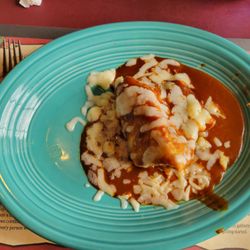 Dona Maria Tamales Restaurant - Chicken Tamal served enchilada style with red sauce