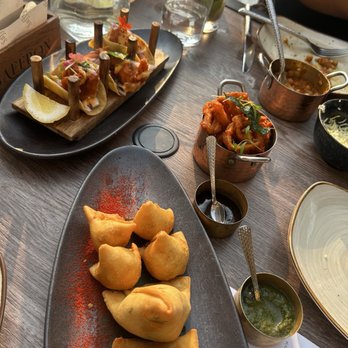 Saffron Modern Indian Dining - Samosa Sampler, Gunpowder Calamari, Shrimp Koliwada Taco, No-Jito Mocktail - Indian Near Me - Milwaukee, Wisconsin Saffron Modern Indian Dining - Samosa Sampler, Gunpowder Calamari, Shrimp Koliwada Taco, No-Jito Mocktail - Indian Near Me - Milwaukee, Wisconsin