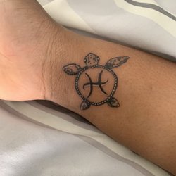 Needle Masters - This is a turtle tattoo with my zodiac symbol in the shell(Pisces)