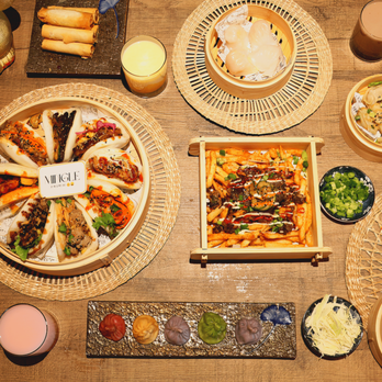 Mingle by Mr and Mrs Bao - A spread featuring baos, fries, dumplings, and spring rolls! - Asian Fusion Near Me - London, Ontario Mingle by Mr and Mrs Bao - A spread featuring baos, fries, dumplings, and spring rolls! - Asian Fusion Near Me - London, Ontario