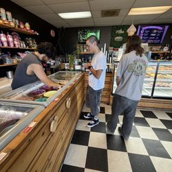 Tonallis Doughnuts & Cream - The man behind the counter serving up some scoops