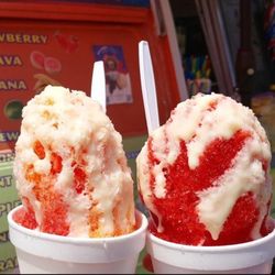 Our most popular snow cones , strawberry & pinapple with condensed milk