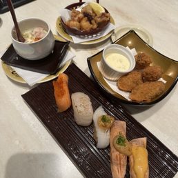 Deep fried oysters and assorted sushi