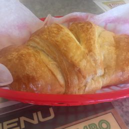 Warm croissant with turkey and Swiss Warm croissant with turkey and Swiss