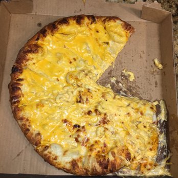 Toppers Pizza - a half eaten pizza in a box - Pizza Near Me - Appleton, Wisconsin