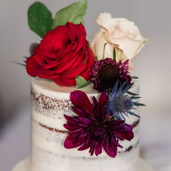 Simply Sweet Cakery - Red Velvet two-tier wedding cake with naked frosting (flowers provided by SWD Floral) - Bakeries Near Me - Costa Mesa, California Simply Sweet Cakery - Red Velvet two-tier wedding cake with naked frosting (flowers provided by SWD Floral) - Bakeries Near Me - Costa Mesa, California