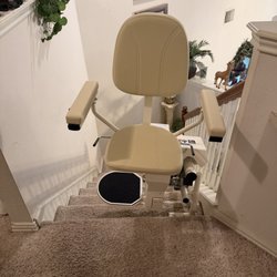 ASAP Lifts - Harmar Helix Stair Lift parked at top of stairs with seat turned out.