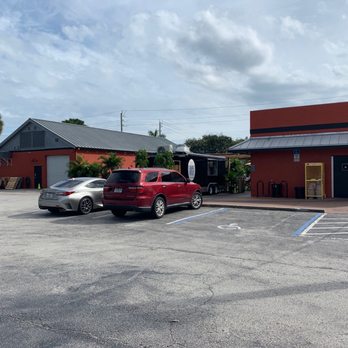 Intruck Coastal Bites - a car parked in a parking lot - Food Trucks Near Me - Melbourne, Florida
