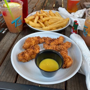 Tiki Docks Riverview - Coconut Chicken with Fries, and the Tiki Rum Punch - Salad Near Me - Riverview, Florida Tiki Docks Riverview - Coconut Chicken with Fries, and the Tiki Rum Punch - Salad Near Me - Riverview, Florida