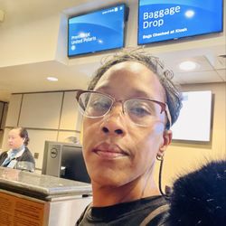 Delta Airlines - I should be smiling....I'm going home