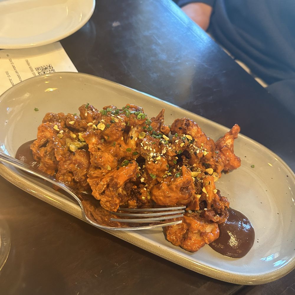 Crispy Harissa Cauliflower: savory fig jam, chive, pistachio dukkah Crispy Harissa Cauliflower: savory fig jam, chive, pistachio dukkah