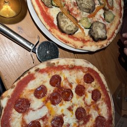 Vegetable pizza and Diavola pizza.