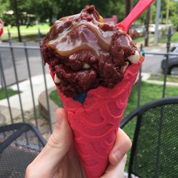 Red Velvet with caramel on top with Monster (blue dough) underneath in a French vanilla cone Red Velvet with caramel on top with Monster (blue dough) underneath in a French vanilla cone